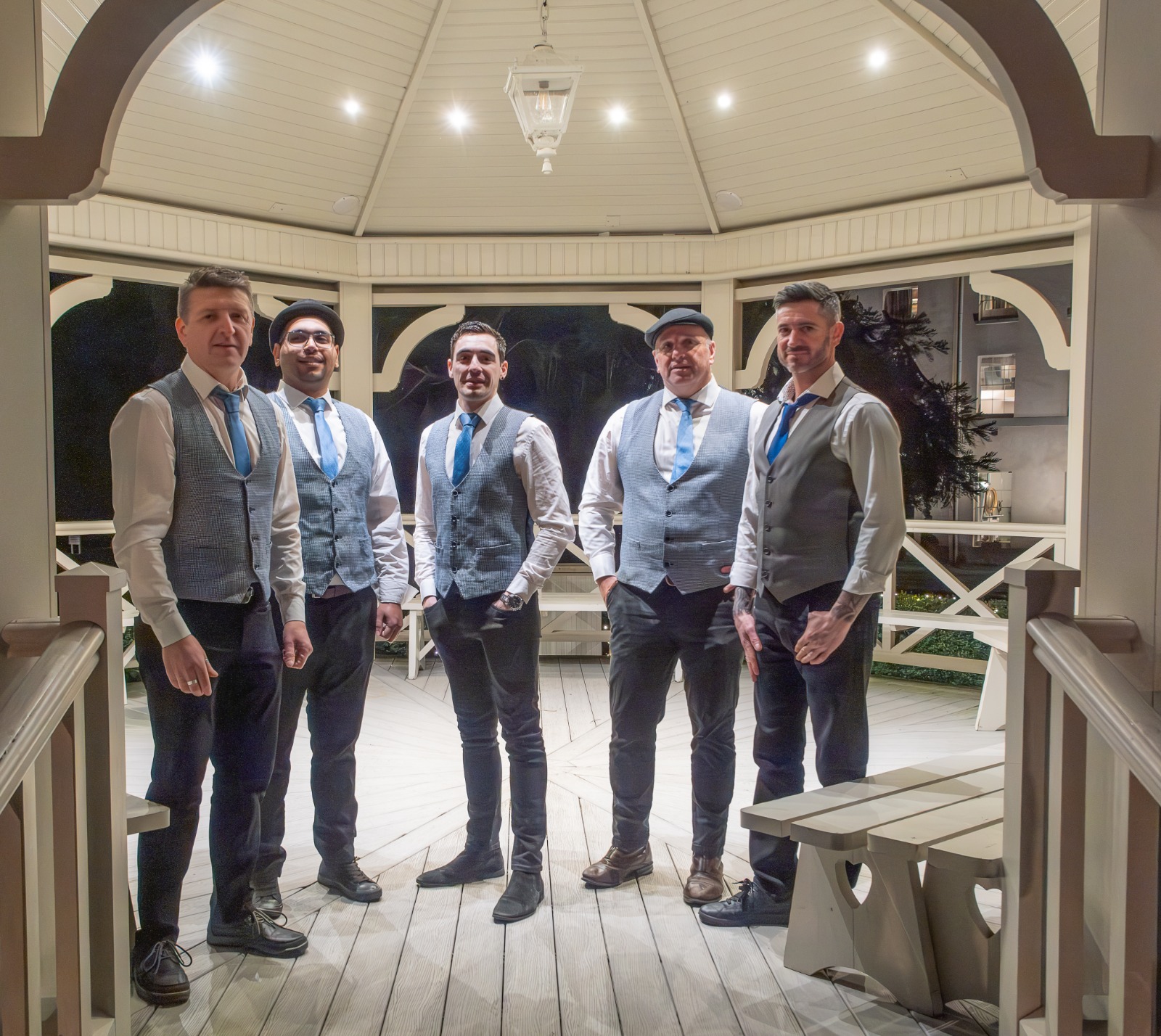 Band on stage with lights and crowd