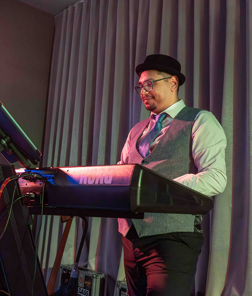 Band members smiling during set